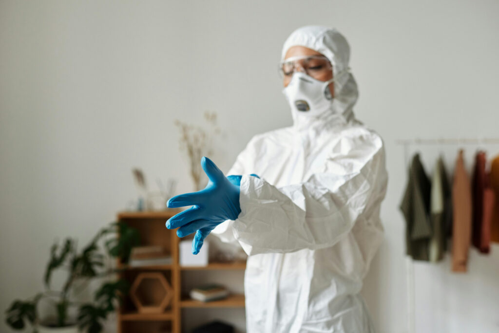 Person in PPE preparing to work Restoration services in Orlando